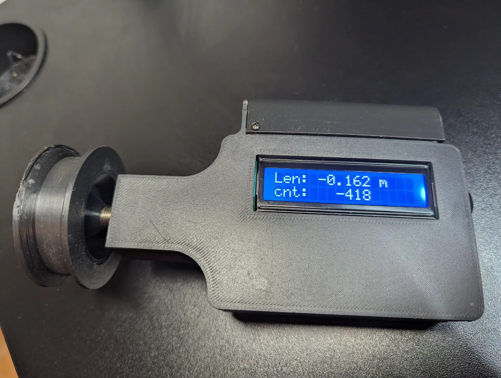 Device in use — display showing measurement