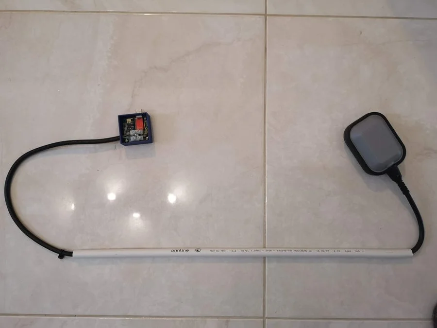 Full assembly of DIY septic alarm showing enclosure, conduit and float switch